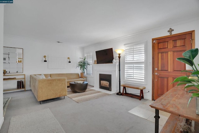 living room featuring ornamental molding and light colored carpet