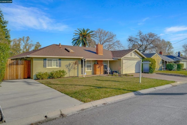 single story home featuring a garage and a front lawn