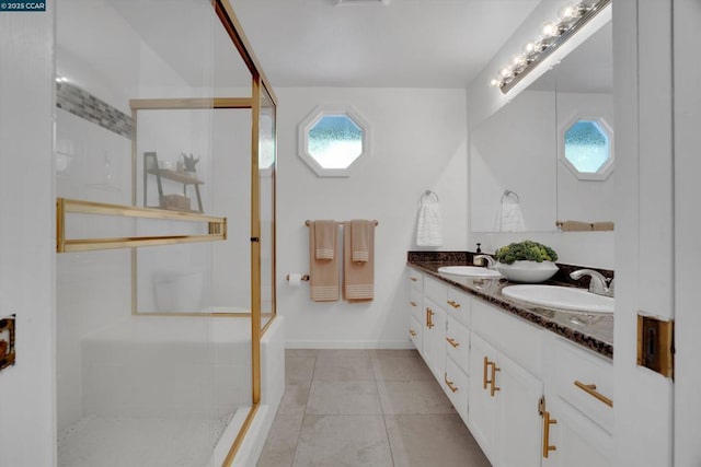 bathroom with vanity, tile patterned floors, and walk in shower