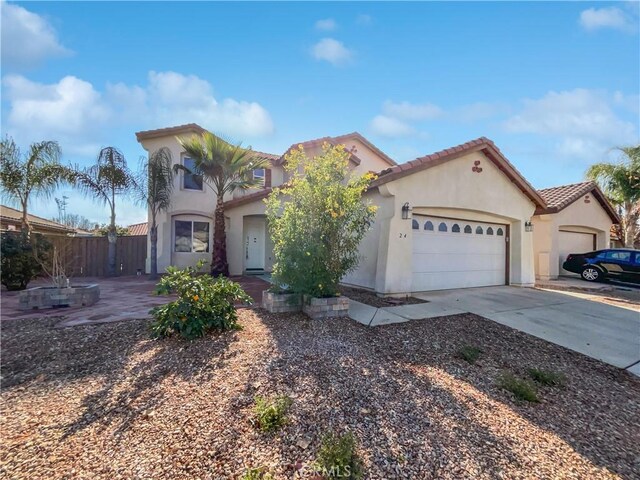 mediterranean / spanish-style house featuring a garage