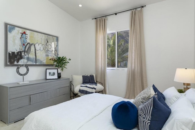 bedroom featuring light carpet