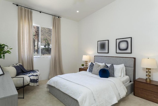 bedroom featuring light carpet