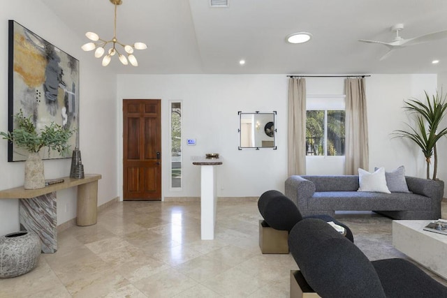 living room with vaulted ceiling and an inviting chandelier