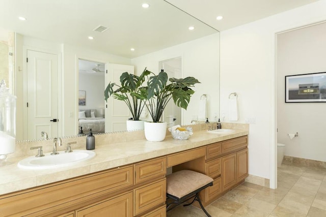 bathroom with vanity and toilet