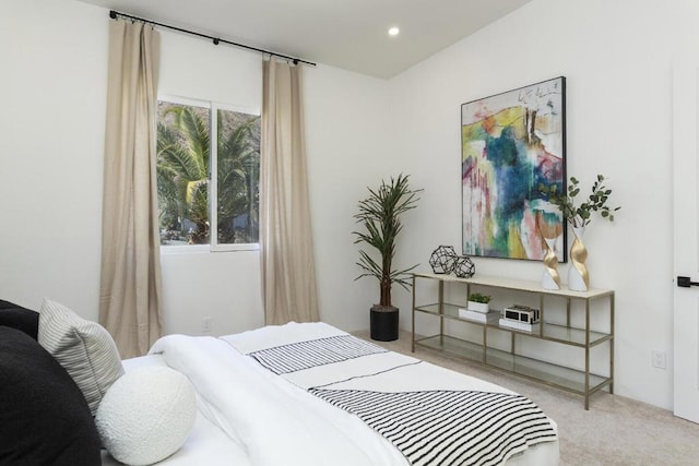 bedroom with light colored carpet