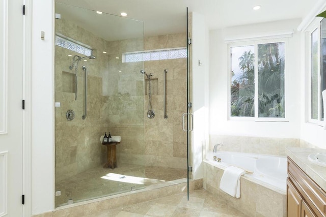 bathroom featuring vanity and plus walk in shower