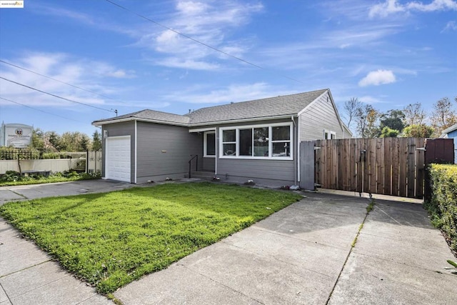 ranch-style home with a garage and a front yard