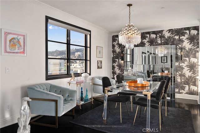 dining room with an inviting chandelier, ornamental molding, and hardwood / wood-style flooring