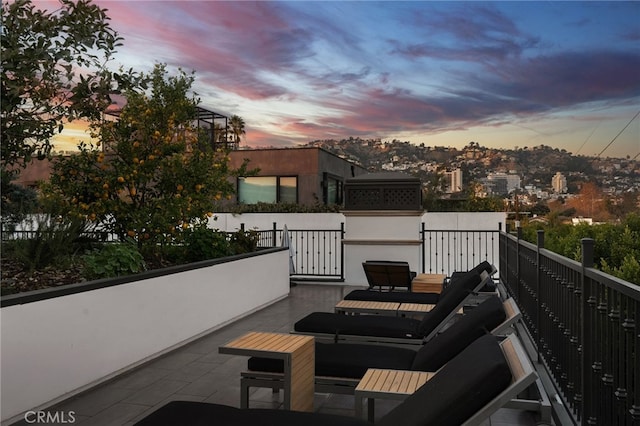 view of balcony at dusk