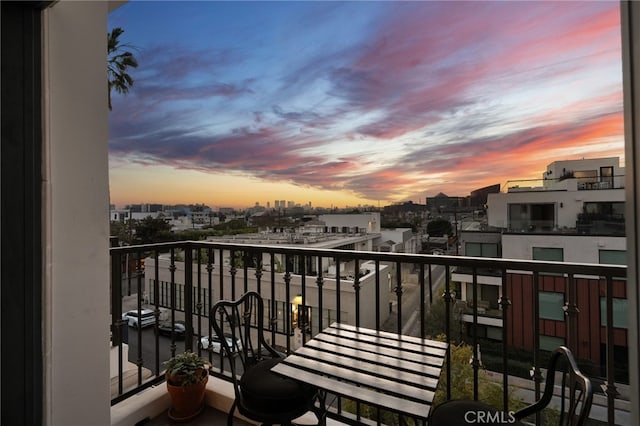 view of balcony at dusk