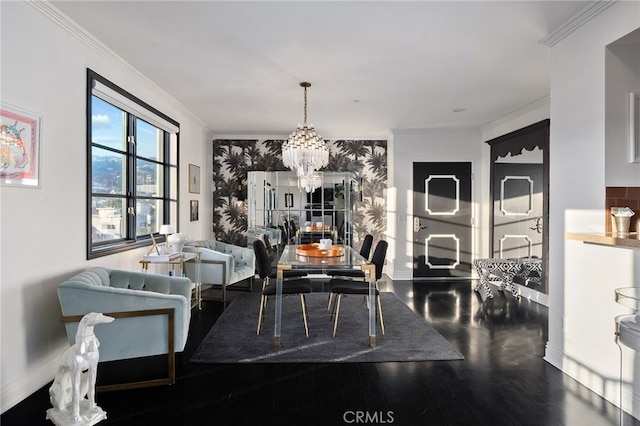 dining area featuring hardwood / wood-style flooring, crown molding, and a notable chandelier