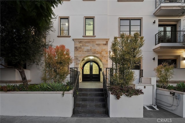 property entrance featuring french doors