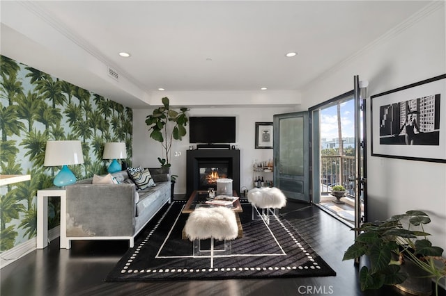 living room featuring ornamental molding and dark hardwood / wood-style floors