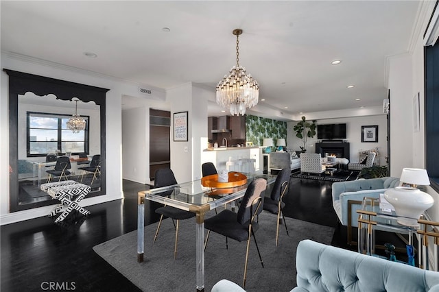 dining space with dark hardwood / wood-style flooring and a chandelier