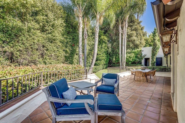 view of patio featuring outdoor dining area