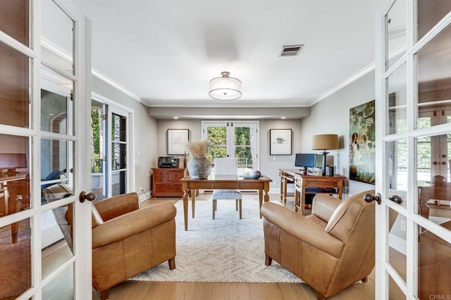 office area with french doors, wood finished floors, visible vents, and crown molding