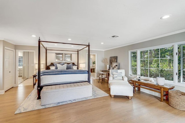 bedroom featuring light wood-style floors, recessed lighting, visible vents, and ornamental molding