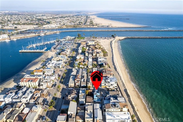 drone / aerial view with a water view and a view of the beach