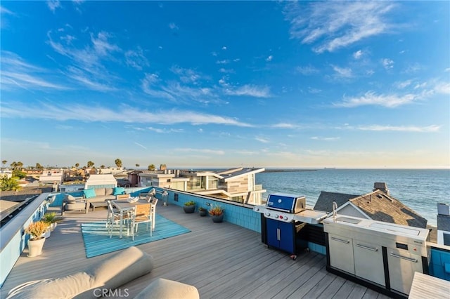 deck featuring a water view