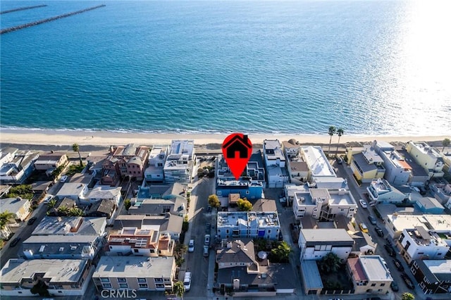 aerial view with a water view, a view of the beach, and a residential view