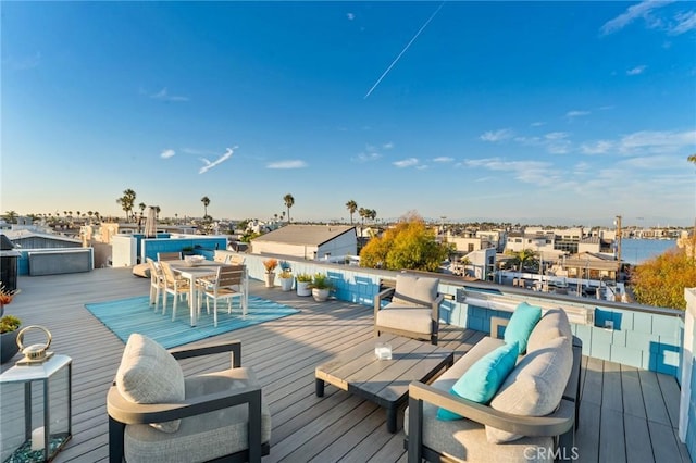 deck with outdoor dining area