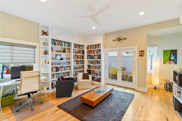 sitting room featuring recessed lighting, french doors, and wood finished floors