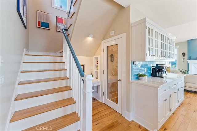 stairs with wood finished floors