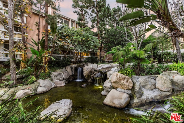 view of yard with a garden pond