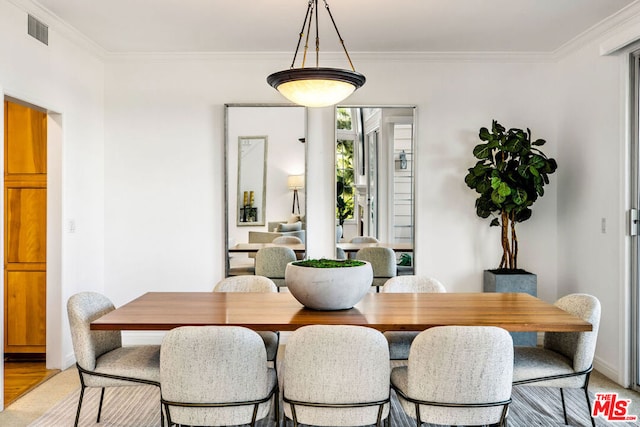 dining room with ornamental molding