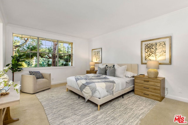 carpeted bedroom featuring crown molding