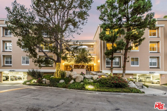 view of outdoor building at dusk