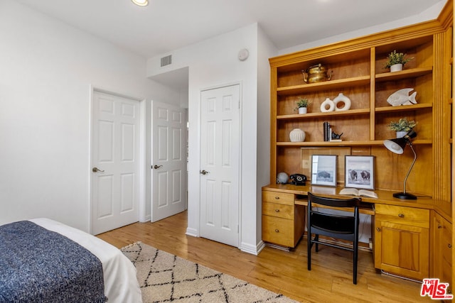 bedroom with light hardwood / wood-style floors