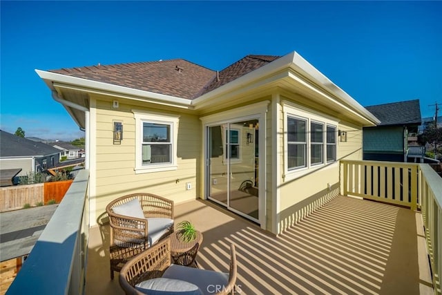 back of property with a balcony