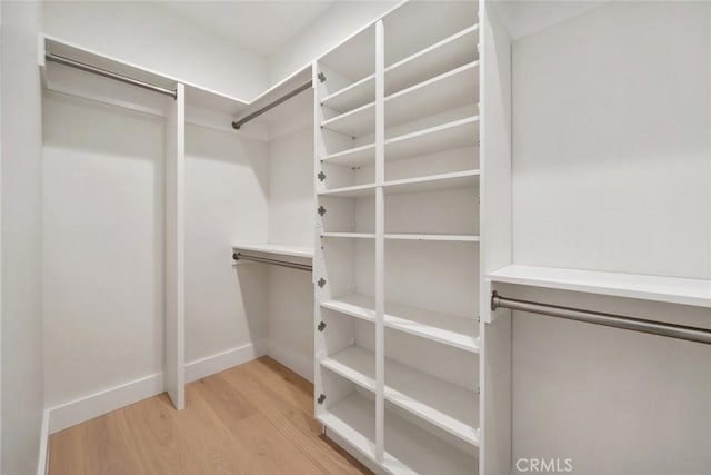 walk in closet featuring light wood-type flooring