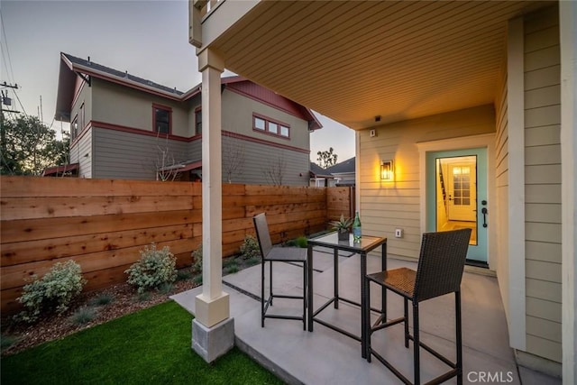 view of patio / terrace with outdoor dining area and fence