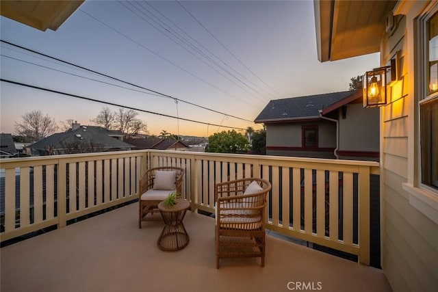 view of balcony at dusk