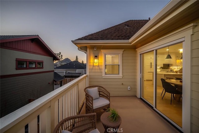 view of balcony at dusk