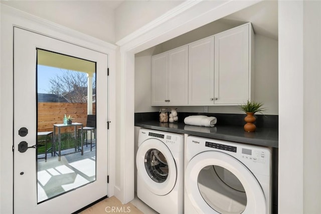 laundry area featuring cabinets and washer and dryer