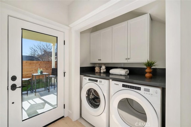 laundry room with cabinet space and separate washer and dryer