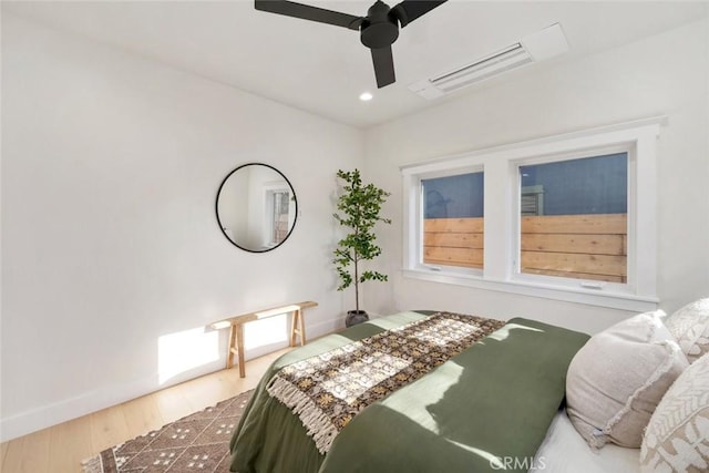 bedroom featuring ceiling fan and hardwood / wood-style floors