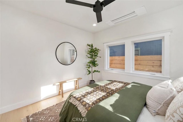 bedroom featuring recessed lighting, ceiling fan, baseboards, and wood finished floors