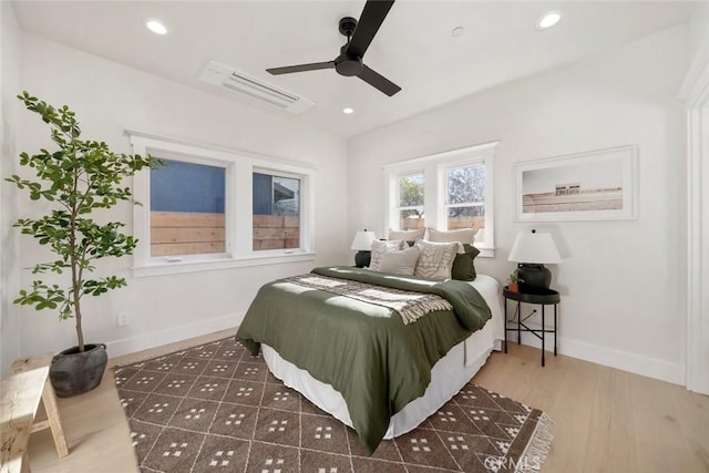 bedroom with ceiling fan and dark hardwood / wood-style flooring