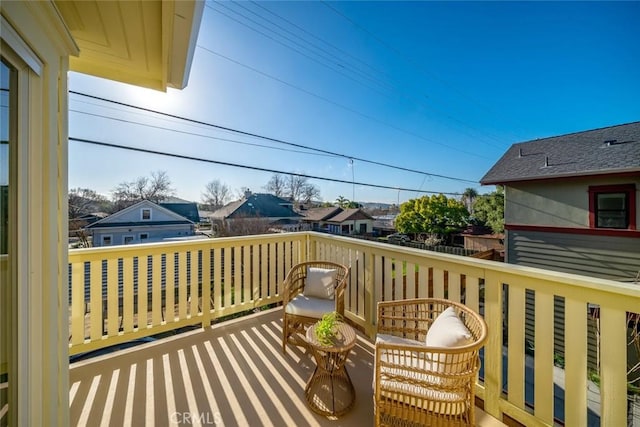 wooden deck with a residential view