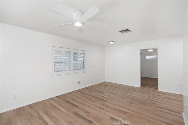 unfurnished room with ceiling fan and light hardwood / wood-style floors