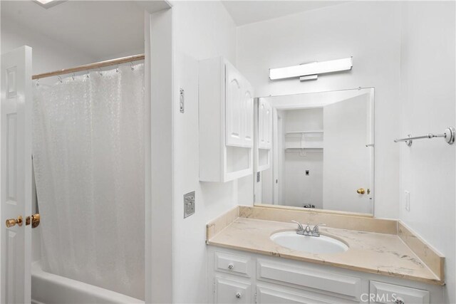 bathroom featuring vanity and shower / tub combo