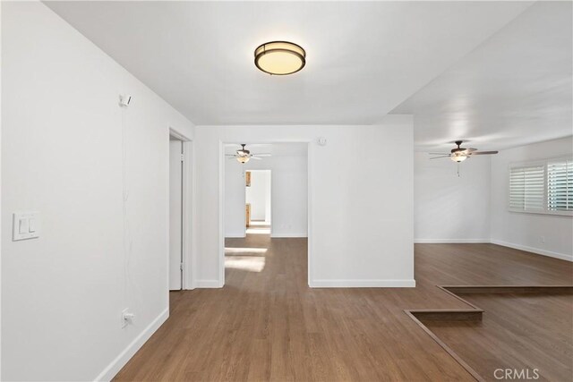 hall with hardwood / wood-style flooring