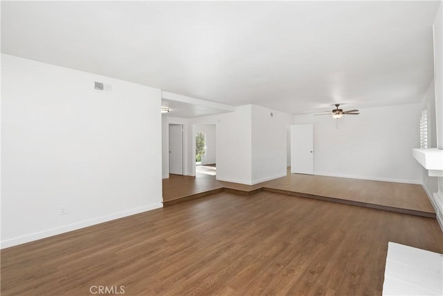 unfurnished living room featuring ceiling fan and hardwood / wood-style floors