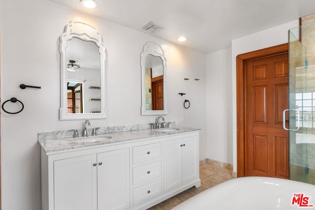 bathroom featuring vanity, tile patterned flooring, and shower with separate bathtub