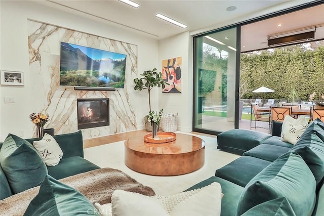 interior space with floor to ceiling windows and a premium fireplace