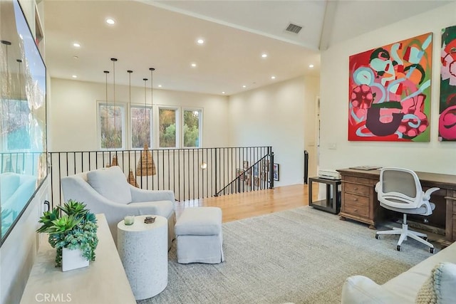 office with light hardwood / wood-style flooring